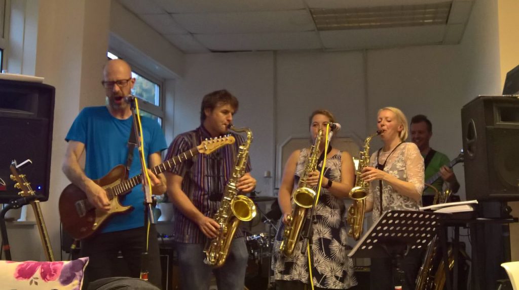 Motif band playing at volunteer thank you event