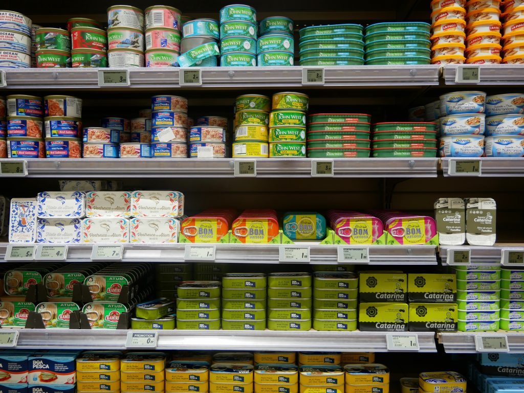 Tins of fish on supermarket shelves