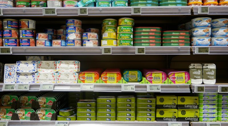 Tins of fish on supermarket shelves