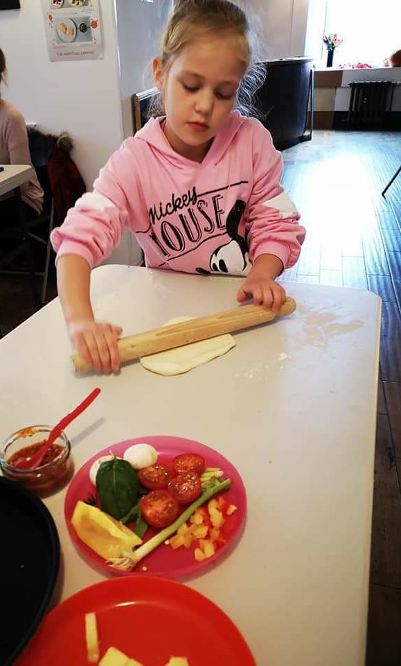 Child rolling pastry