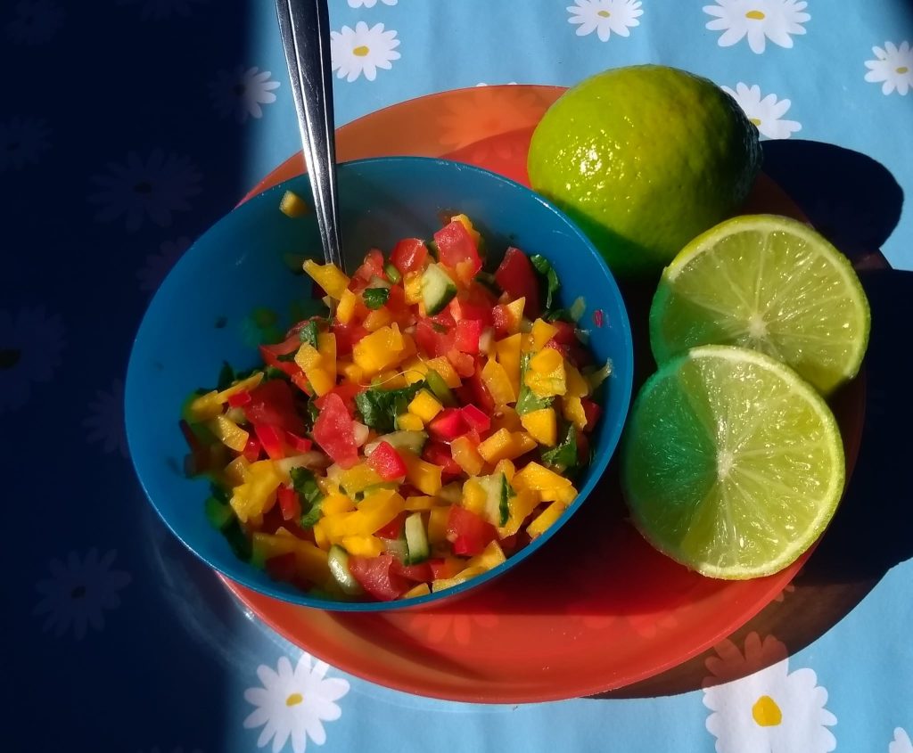Bowl of peppers and limes