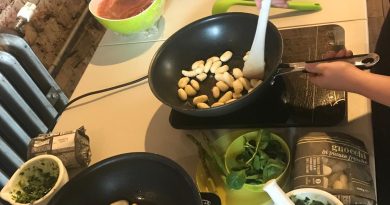 Kids cooking gnocchi in frying pans