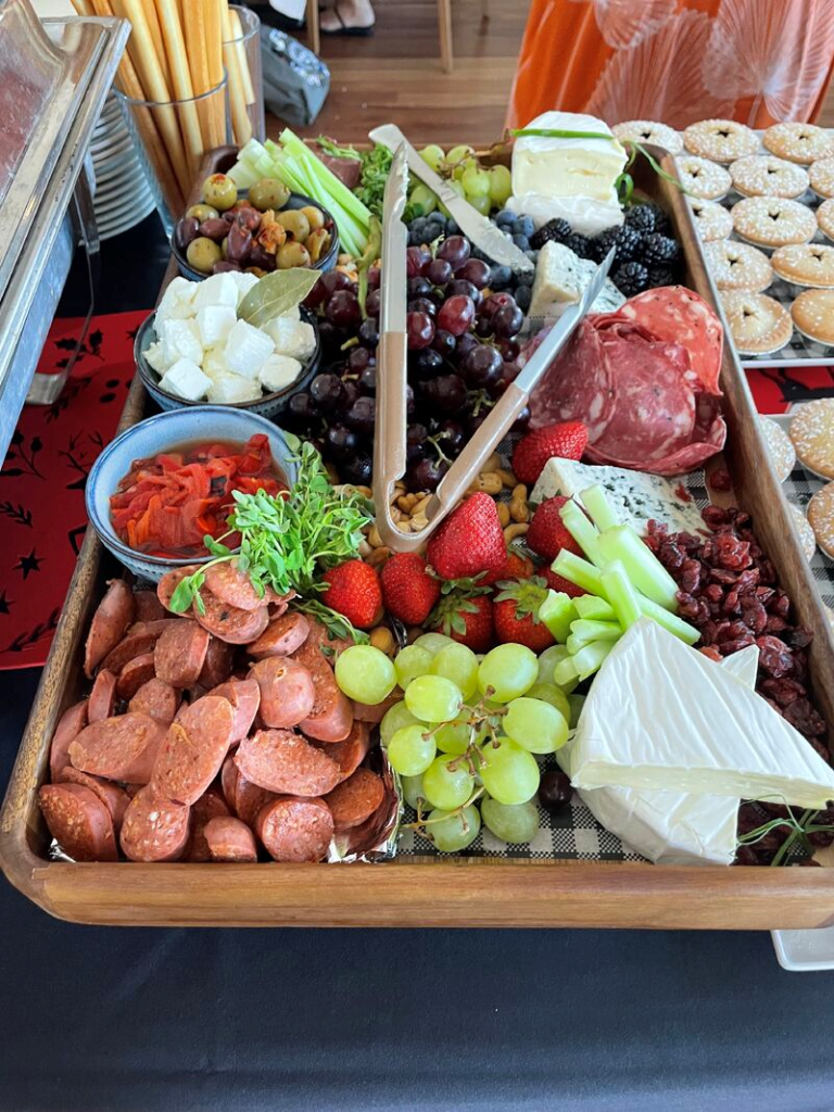 Tray of cold meats, cheeses, fruit and salads