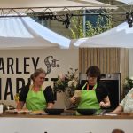 Three chefs demonstrating a recipe in Darley Street Market