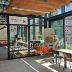 The FoodSavers Wellnest events space, a light and airy corner room in Darley Street Market with large glass windows.