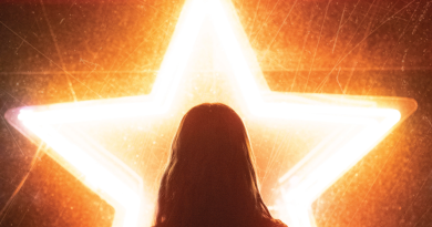 Silhouette of a woman in front of a neon star