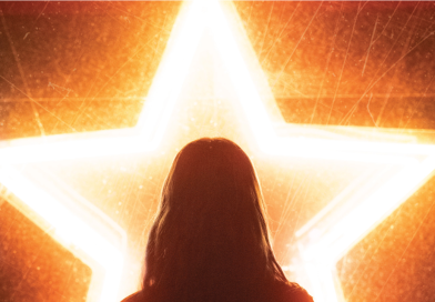 Silhouette of a woman in front of a neon star
